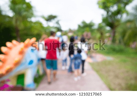 Blurry pictures of family visiting holiday amusement park, images used for backgrounds.