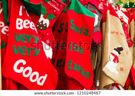 Big Christmas socks in shop. New year and merry christmas concept. Good wishes. Soft selective focus, copy space
