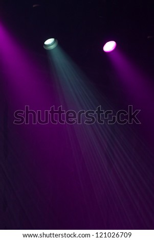 Lights through the smog on a concert