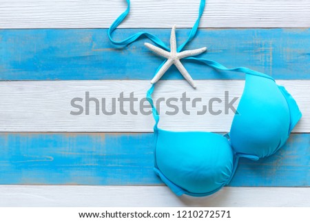 Summer Fashion woman swimsuit Bikini. Tropical sea.Unusual top view, blue and white background. Summer Concept.