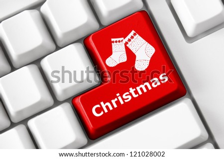 Modern keyboard with color button, Christmas socks image and Christmas text. Concept