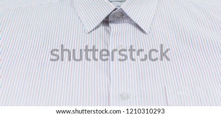 Close up of pink and white striped shirts. Business clothes isolated for background. Surface of casual or formal t shirt uniform for beauty and fashion concept. texture of plaid Mens for work outfit