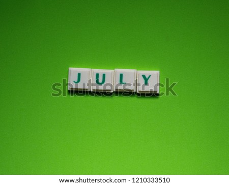 Created word of "July" with the letters on the green screen background
