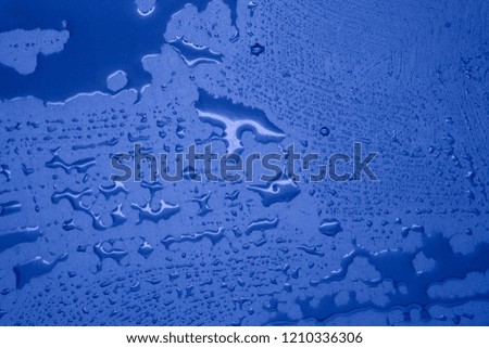 Water drops on blue background, texture