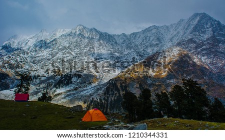This image is of Indrahar Pass, covered in snow, taken from snowline cafe near at an altitude of 4342 meters.  Royalty-Free Stock Photo #1210344331