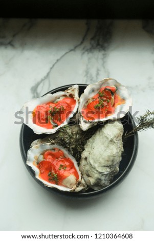 Oyster appetizer with hot sauce