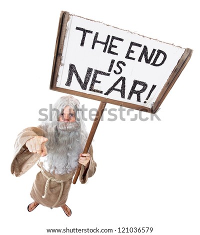 Visionary with a sign of the end is near.Prophet holding board by the end of the world, isolated on white background. Seer warns about near the end and pointing the finger at you, view from above.