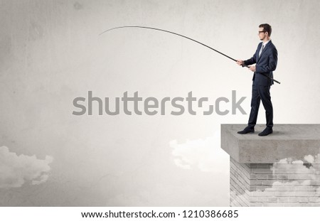 Businessman fishing nothing from the cloud with free copyspace