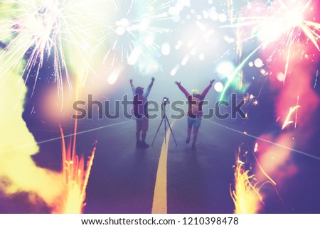 Travel nature Lover asian women and asian man Take a picture Shoot the fireworks In New Year's Mountain. Thailand