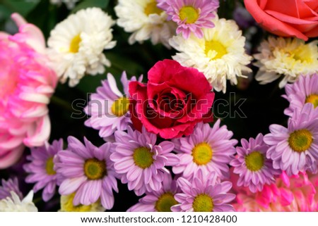Pattern of natural flowers background texture. beautiful bouquet of mixed flowers in a vase. the work of the florist at a flower shop. background on full screen                               