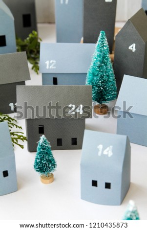 Christmas, Advent calendar, paper gray houses, spruce, holiday concept