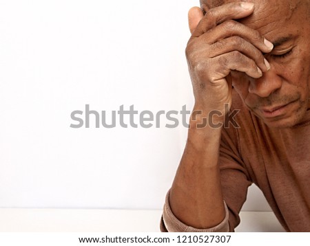 man with depression and migraine headache stock photo