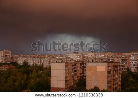 Dark rainy clouds. Stormy weather. Beautiful landscape. Nature concept. Apocalyptic sky. The end of the world.