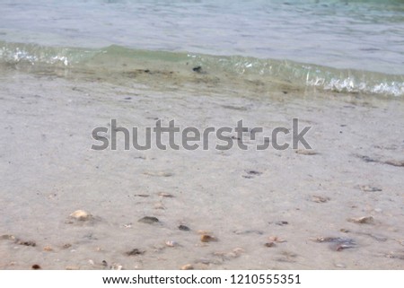 Sea wave on the sand. Photo.