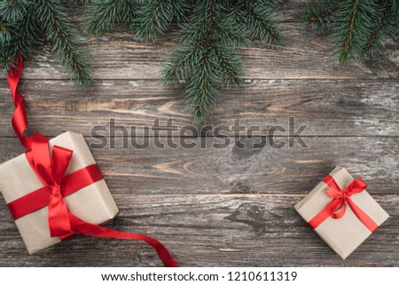 Old wood background with fir branches. Holiday Gifts. Christmas card. Top view. Royalty-Free Stock Photo #1210611319