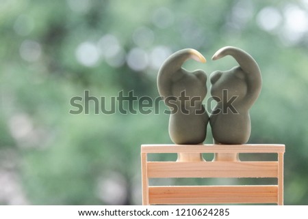Ceramic frog doll couple on a chair
 wooden sarang hae yo concept valentines  day