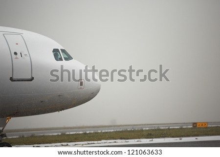 Airport runway in bad weather, Prague