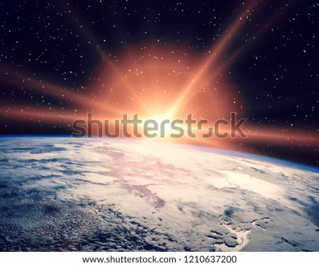 Earth from space during a sunrise. The elements of this image furnished by NASA.
