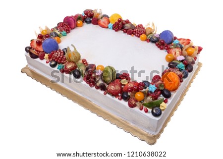 Delicious birthday cake from fruit. On a white background.