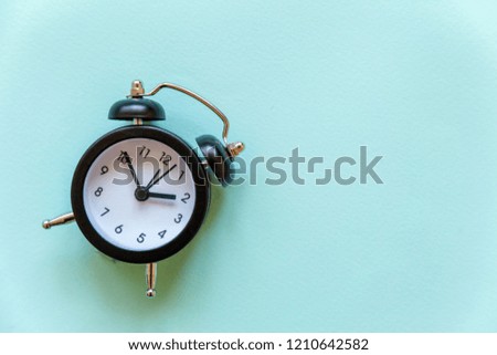 Ringing twin bell vintage classic alarm clock Isolated on blue pastel colourful trendy background. Rest hours, time of life, good morning night, wake up, awake concept. Flat lay, top view, copy space