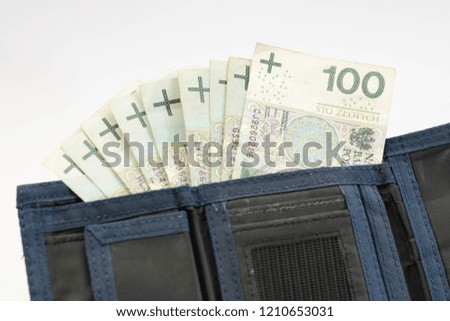 Polish Zloty banknotes (PLN) closeup. Polish One Hundred Zlotych in black wallet