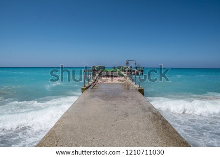 pier on tropical paradise ocean beach with blue water. travel concept