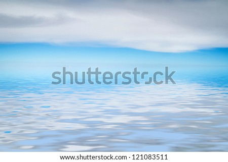 Blue sea and sky background with long white cloud