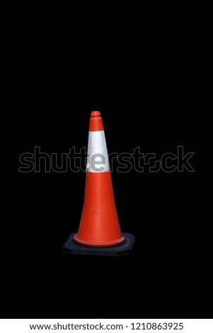 Traffic cone that is separate from the background on the backdrop.