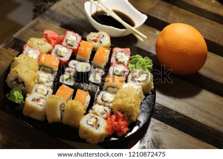 Bright and appetizing still life with a set of Japanese roll and soy sauce. Delicious and healthy seafood and rice