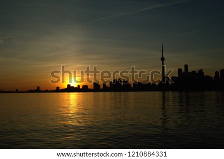 city from water sunset