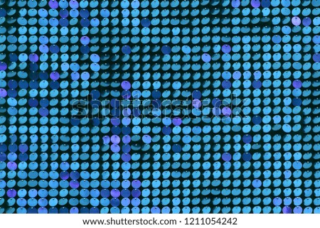 Abstract background of a variety of blue sparkles.