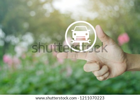 Hand pressing service fix car with wrench tool flat icon over blur pink flower and tree in garden, Business repair car concept
