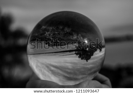 Glass ball sphere in black and white outdoors