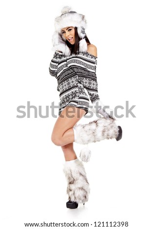 Winter portrait of attractive girl in hat and warm clothes, over white background.