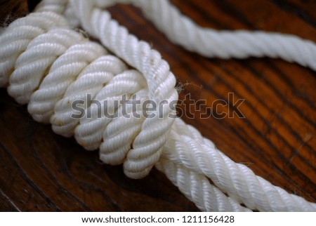 detail of a sailors knot on a wood