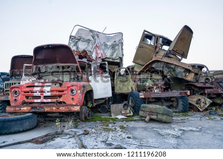 abandoned radioactive technik that participated in the liquidation of the accident. military and fire trucks