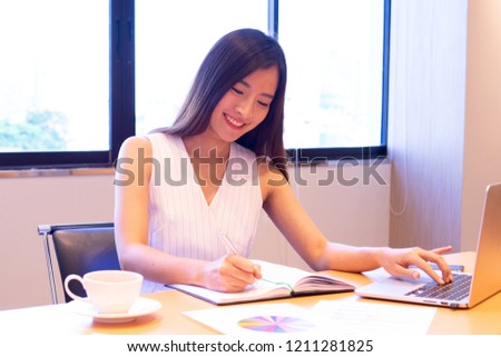 happy sales person checking report