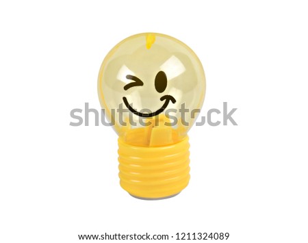 Light bulb or lamp toy yellow emoticons smile isolated on white background  with clipping path.Concept Business idea to make money.