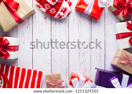 Christmas gift box on white wooden table. Flat lay with copy space.
