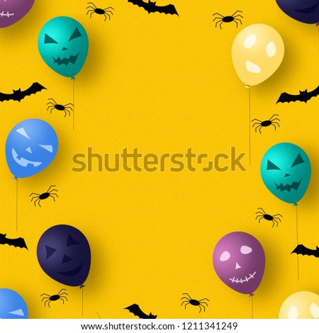 Halloween background with inflatable balls on a yellow background with spiders and bats. Copy space. Holidays.
