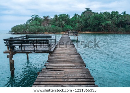 Wooden bridge with shelters on a sea dock