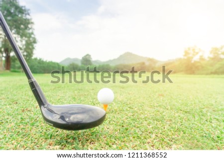 golf ball on green grass ready to hit from t-off in beautifull tropical golf course for background or poster.