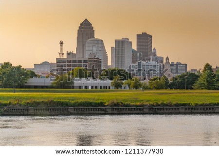 City skyline of Des Moines, Iowa across the Racoon River at sunset
