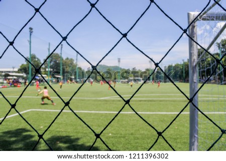 Picture of kids soccer training and football match between youth soccer teams.