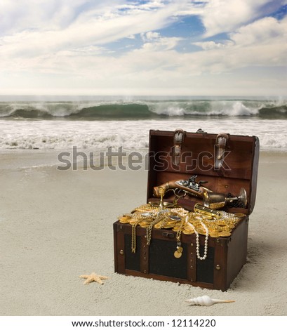 Open treausre chest on a deserted beach