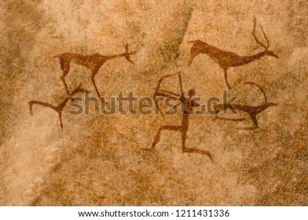 image of an ancient hunt on a cave wall. history of antiquities, era, era.