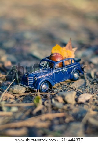 Chernigiv, Ukraine. October 09, 2018. Little model toy of retro car in the autumn forest. Selective focus, toned image