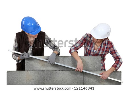 duo of female bricklayers