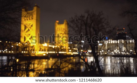 Out of focus background plate of Tower Bridge and downtown Sacramento at night
