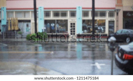 Background Plate of Rainy city street with parking meters and parked cars